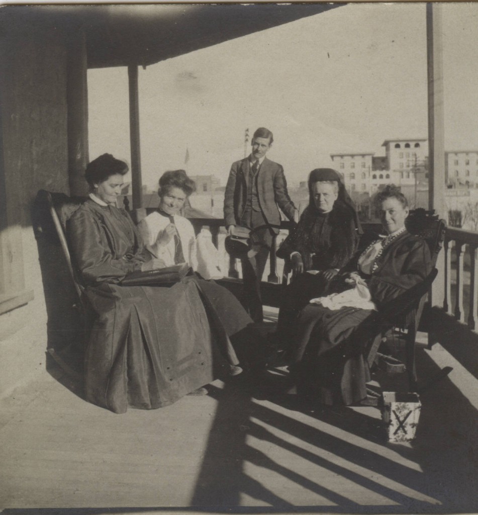 Blenman Family at the Hall Hotel with the Santa Rita Hotel in the Background. 