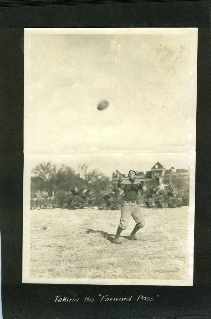 Taking the forward pass in front of "Old Main" in 1909