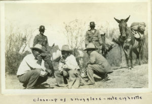 Close -up of smugglers - note cigarette