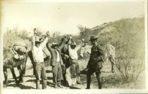 Booze smugglers with hands in the air