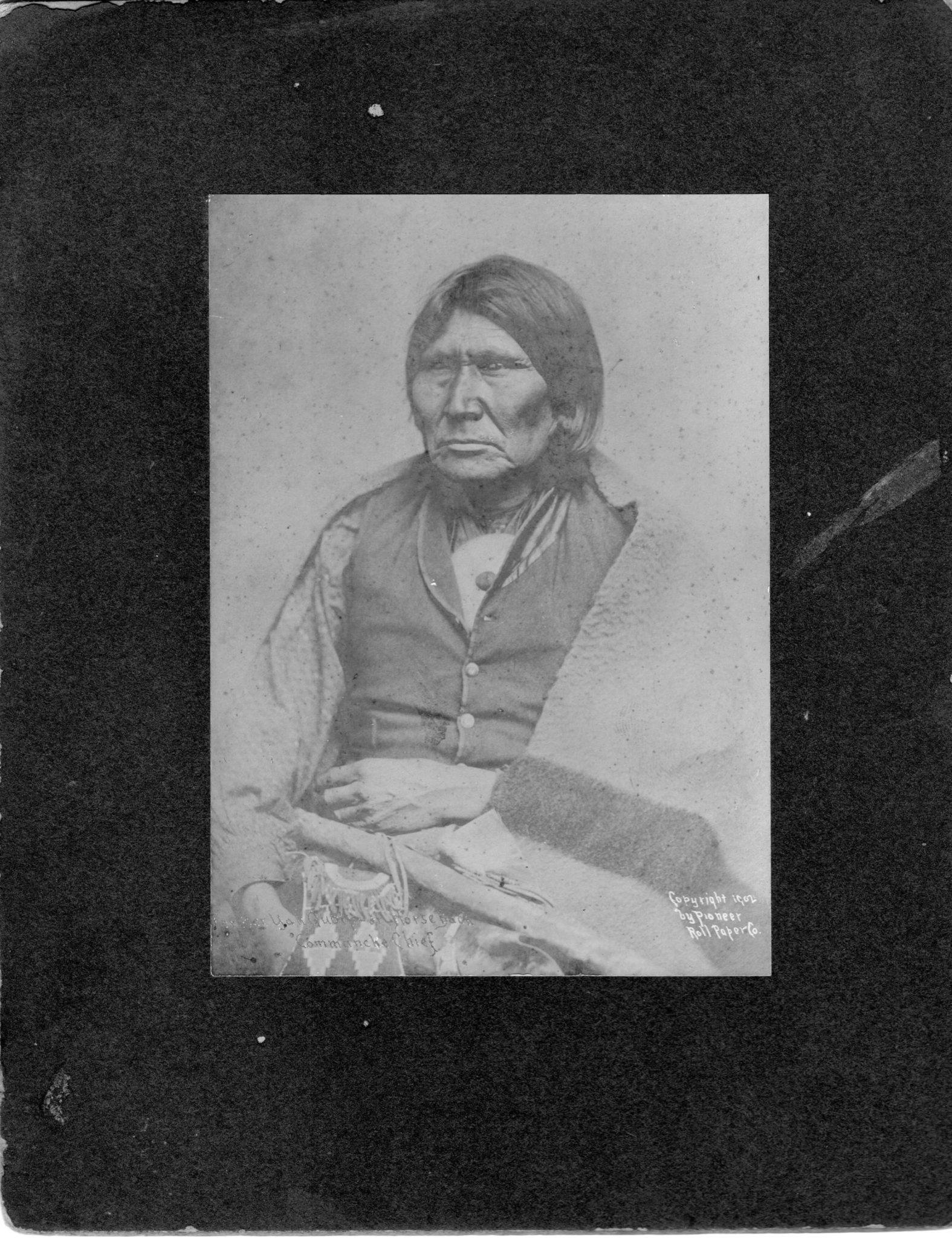 Her YahQuolp or "Horseback" Cammanche Chief Copyright 1902 by Pioneer Roll Paper Co.