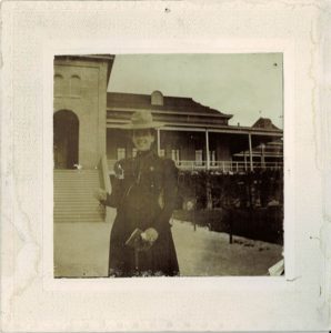 Co-ed in front of U of A Old Main Building Photograph